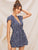 Plunging Neck Ditsy Floral Wrap Romper