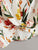 Ruffle Armhole Twist Hem Floral Top